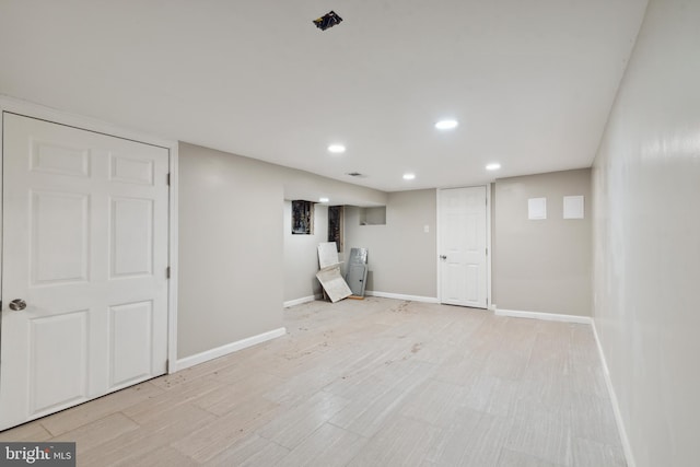 basement featuring light hardwood / wood-style floors