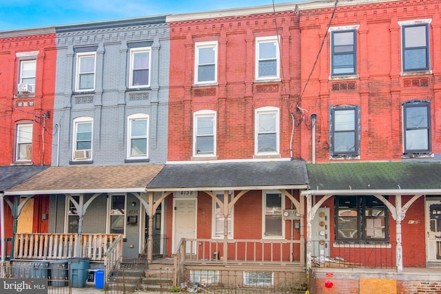 townhome / multi-family property with covered porch