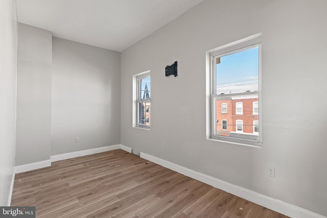 spare room with light hardwood / wood-style flooring