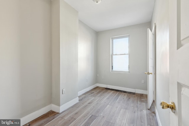 unfurnished room featuring light wood-type flooring