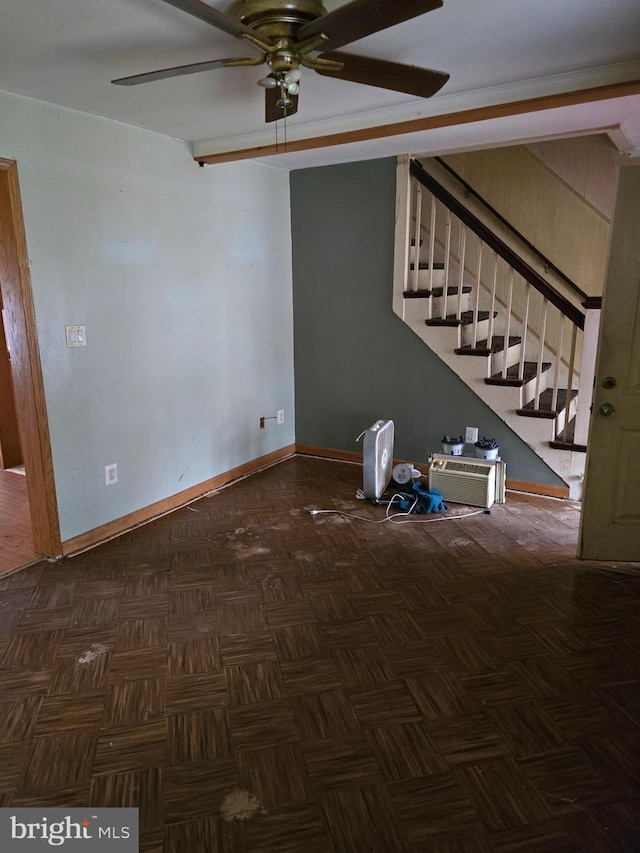 interior space with dark parquet flooring and ceiling fan