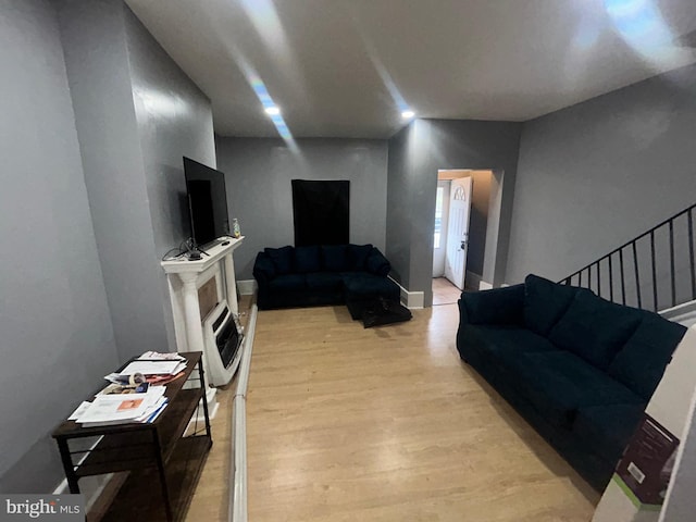 1723 N 53rd St, Philadelphia, PA 19131 - living room featuring light wood-style flooring, heating unit, and stairs