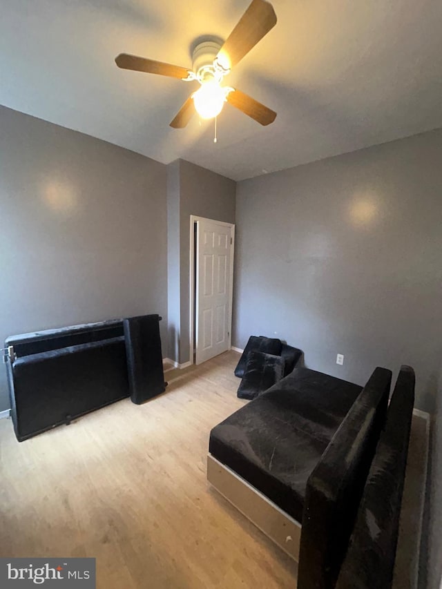 bedroom with ceiling fan and light wood-type flooring