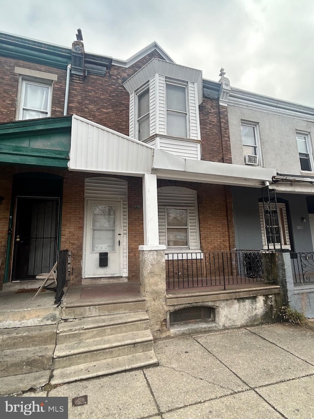 view of property featuring a porch