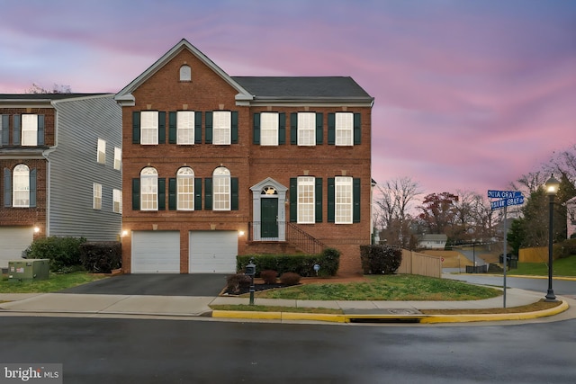 view of front of home featuring a garage and central air condition unit