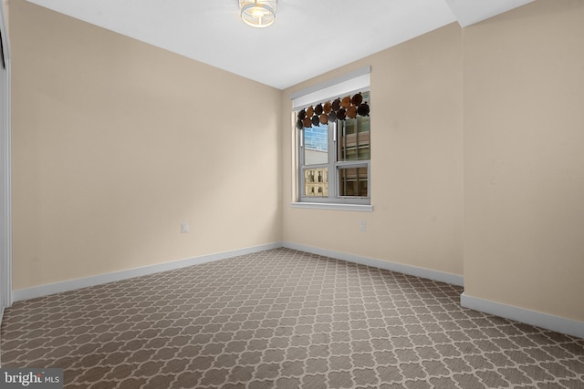 spare room featuring carpet floors