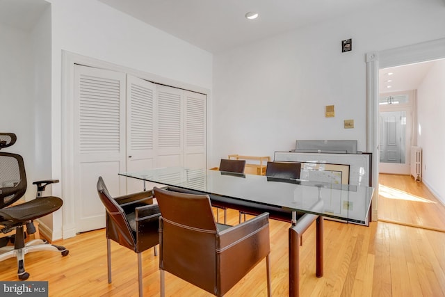 136 E St SE, Washington, DC 20003 - dining area with radiator heating unit, light wood-style floors, and recessed lighting