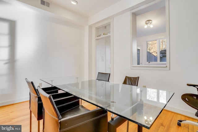 dining area featuring hardwood / wood-style floors