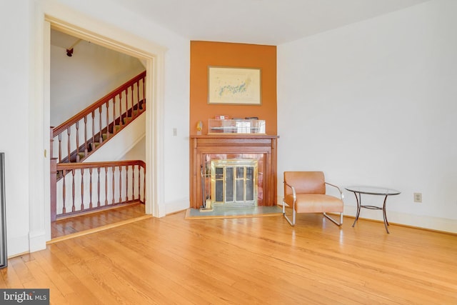 136 E St SE, Washington, DC 20003 - sitting room featuring a glass covered fireplace, wood finished floors, and stairs