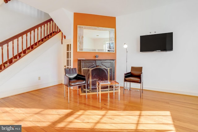 sitting room featuring wood-type flooring