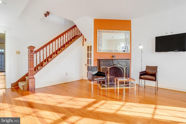 136 E St SE, Washington, DC 20003 - living area featuring stairs, wood finished floors, and a fireplace
