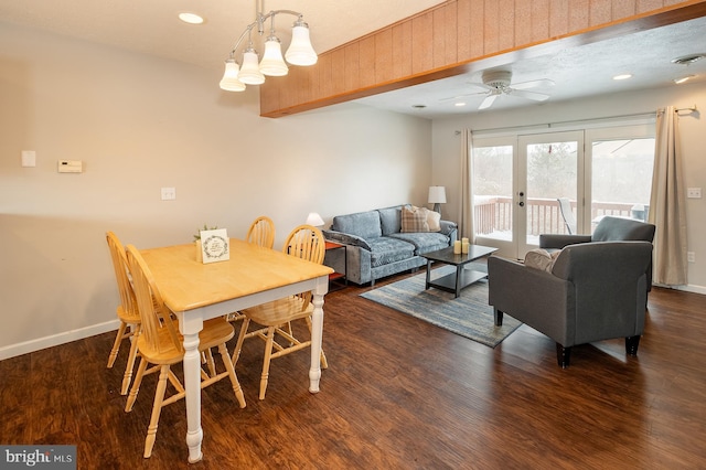 dining space featuring dark hardwood / wood-style floors, ceiling fan, and french doors