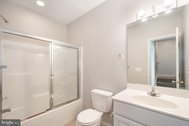 full bathroom with vanity, toilet, and enclosed tub / shower combo