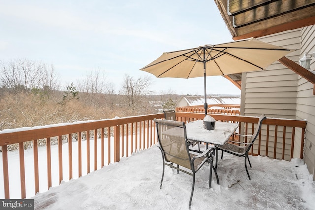 view of snow covered deck