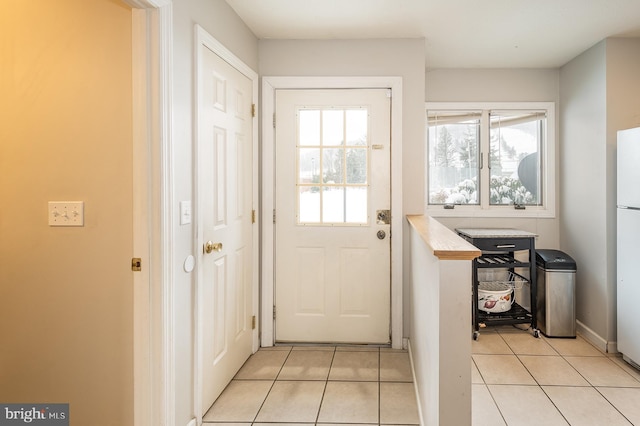 doorway featuring light tile patterned floors