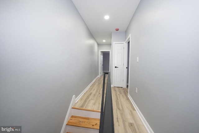 hall with hardwood / wood-style floors