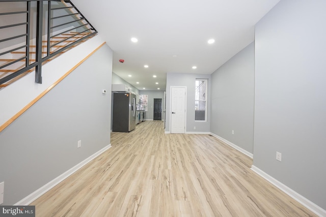 unfurnished living room with light hardwood / wood-style flooring