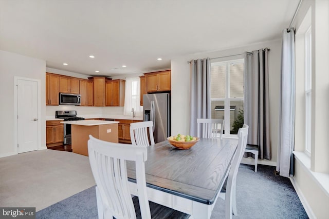 dining room with sink and carpet