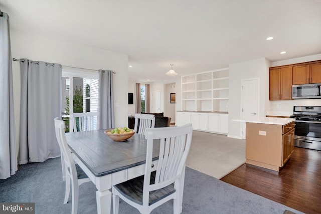 dining room with dark hardwood / wood-style flooring