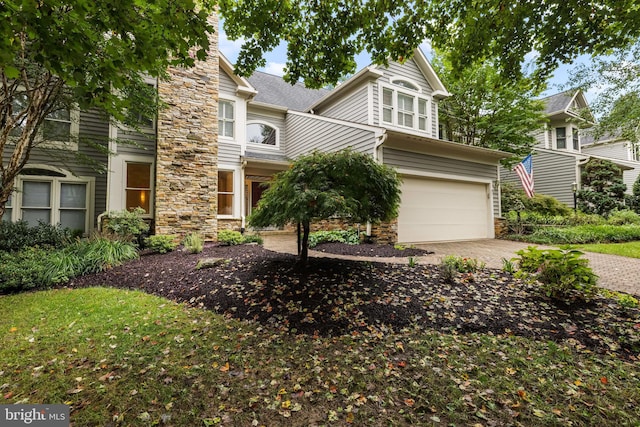 view of front of property with a garage