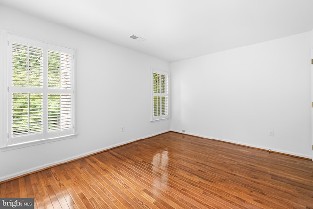 unfurnished room featuring wood-type flooring