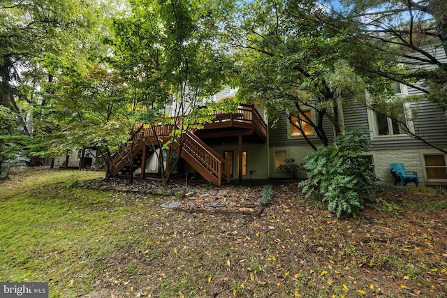 back of house with a wooden deck