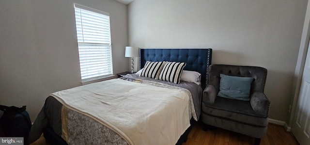 bedroom featuring dark hardwood / wood-style floors