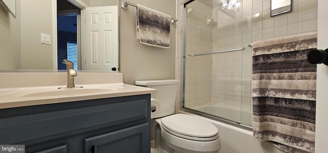 full bathroom with vanity, toilet, and shower / bath combination with glass door