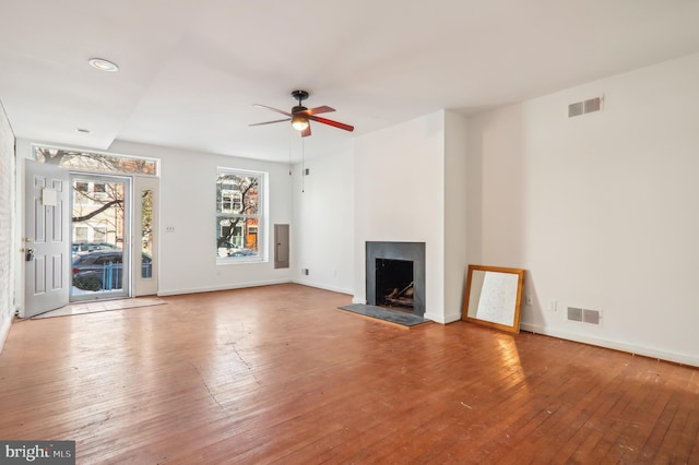 unfurnished living room with ceiling fan and light hardwood / wood-style floors