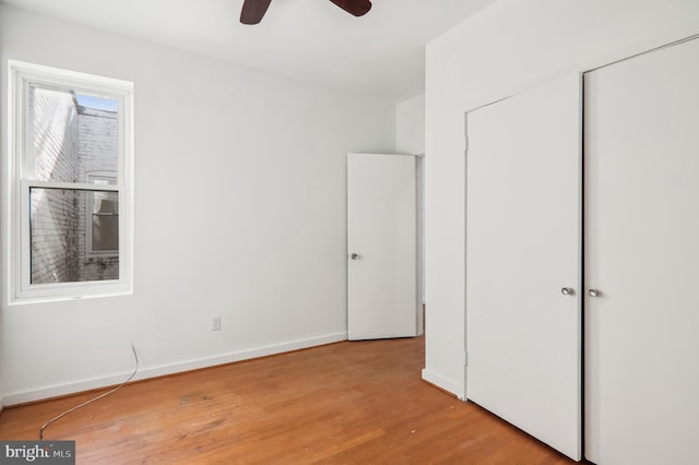 unfurnished bedroom featuring ceiling fan and light wood-type flooring