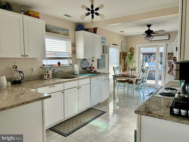 kitchen featuring white cabinetry, french doors, sink, light stone countertops, and white appliances