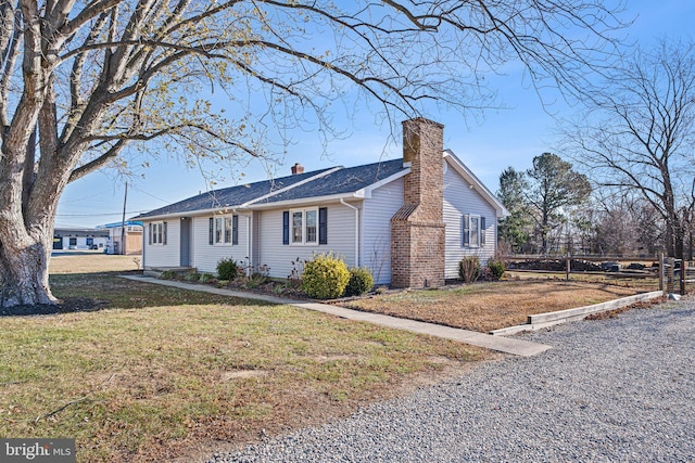 view of home's exterior with a lawn