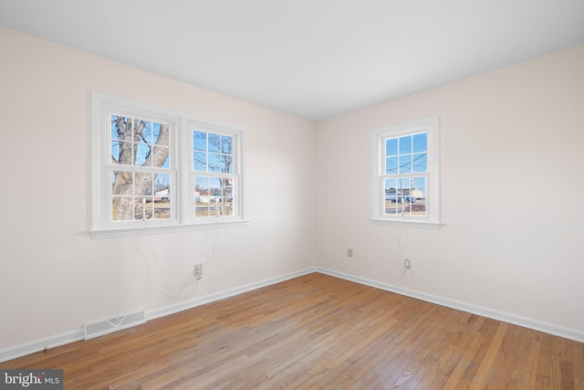 unfurnished room featuring light wood-type flooring