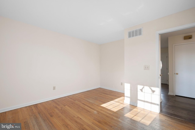 unfurnished room featuring wood-type flooring