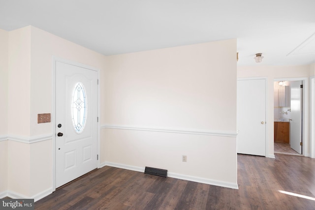 entryway with dark hardwood / wood-style floors