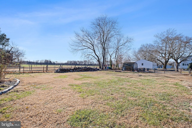 view of yard with a rural view