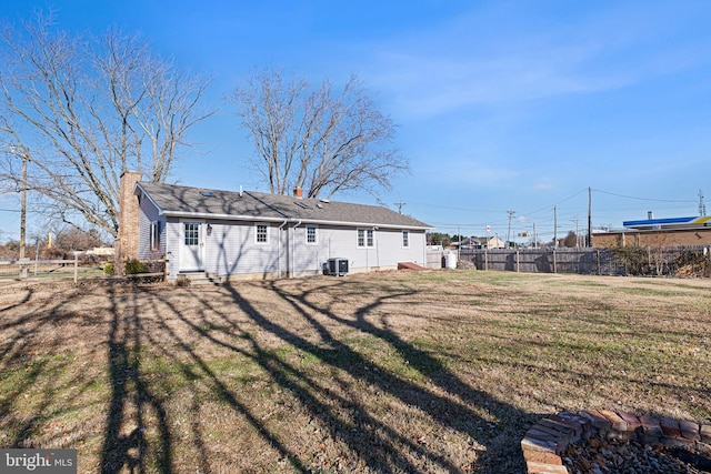 rear view of house with a lawn