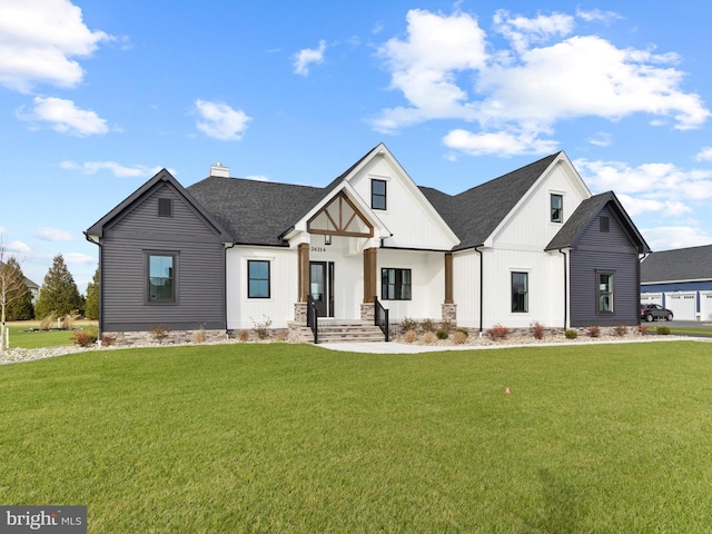 modern farmhouse style home featuring a front lawn