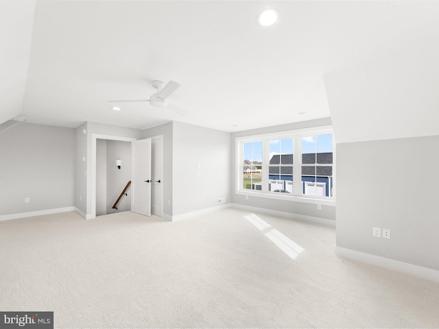 bonus room with light carpet, ceiling fan, and lofted ceiling