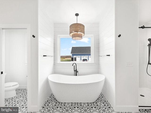 bathroom featuring tile patterned floors, separate shower and tub, and toilet