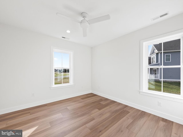 unfurnished room with light hardwood / wood-style floors and ceiling fan