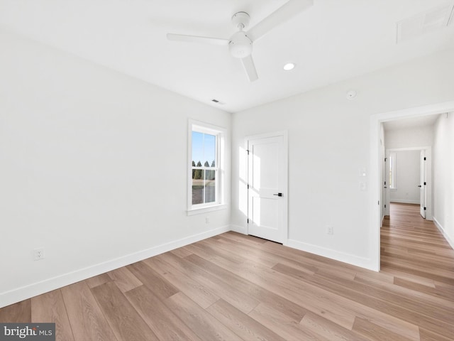 spare room featuring ceiling fan and light hardwood / wood-style flooring