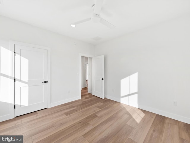 unfurnished bedroom featuring light hardwood / wood-style floors and ceiling fan