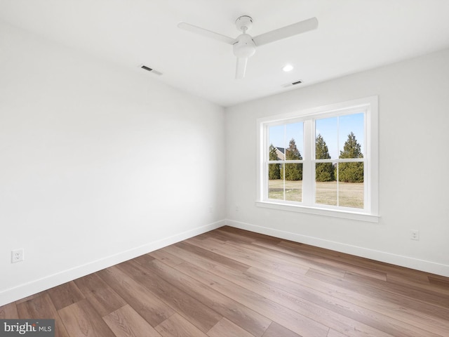 unfurnished room featuring ceiling fan and light hardwood / wood-style flooring