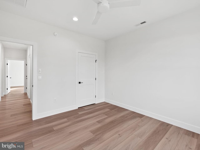 unfurnished room featuring light wood-type flooring and ceiling fan