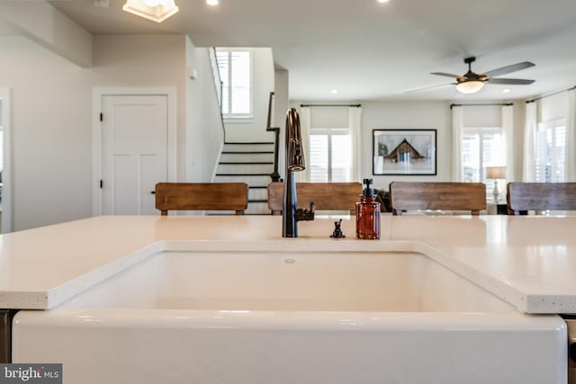 kitchen featuring ceiling fan, a healthy amount of sunlight, and sink