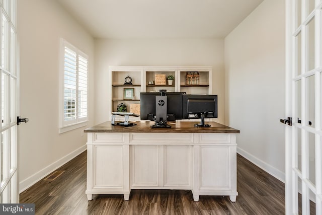 office space featuring french doors and dark hardwood / wood-style floors