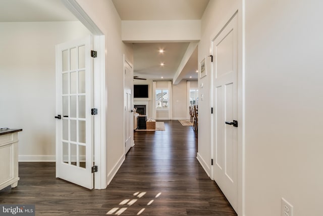 corridor featuring dark hardwood / wood-style floors