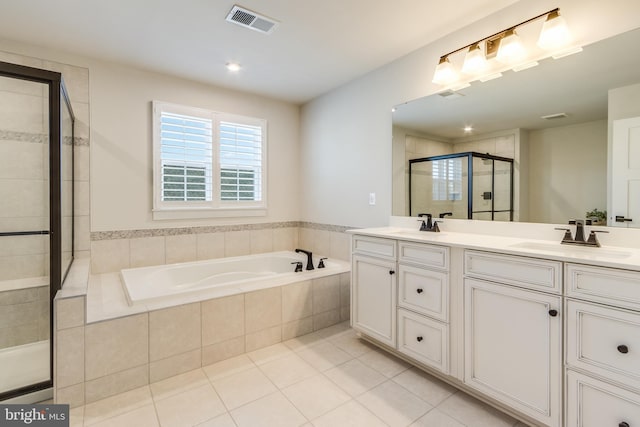 bathroom with vanity, tile patterned floors, and separate shower and tub