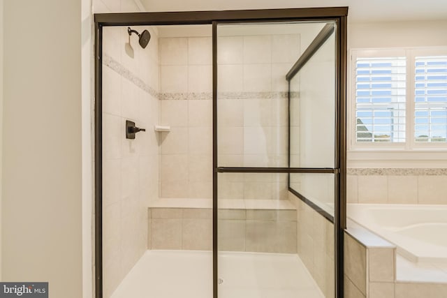 bathroom featuring plus walk in shower